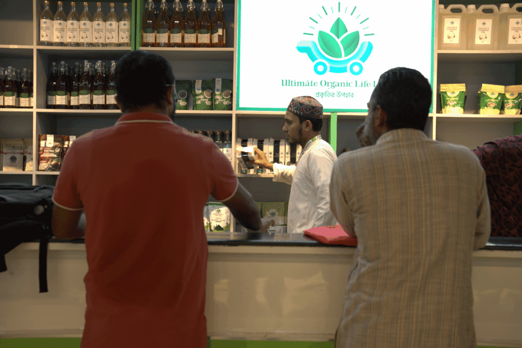 Customers receiving guidance at the Ultimate Organic Life store while exploring certified organic products