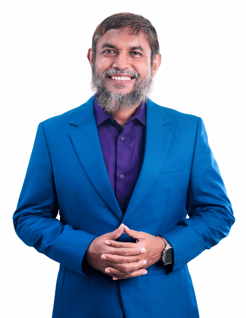Professional portrait of a smiling male executive in a blue suit standing with hands clasped on a transparent background.